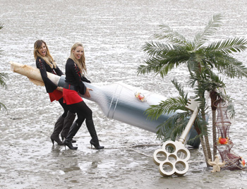  From left: At the launch of ‘The Captain’s Island’ are Morganettes Aoife Cogan and Suzanne McCabe who found a giant message in a bottle on Sandymount Strand sent by Captain Morgan from his Caribbean Island.