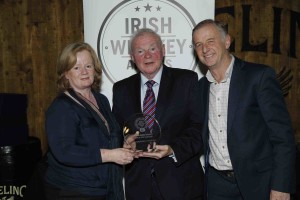John Teeling of Teeling Distillery presesents the awards for Irish Blended Whiskey of the Year (RRP less than €60) for Tullamore Dew 12 Year-Old and Irish Cask Strength Whiskey Award for Tullamore Dew Phoenix to Nora McNulty and John Quinn of William Grant & Sons.  