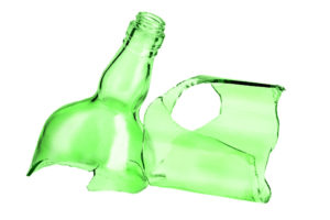 Parts of broken green bottle isolated on white background