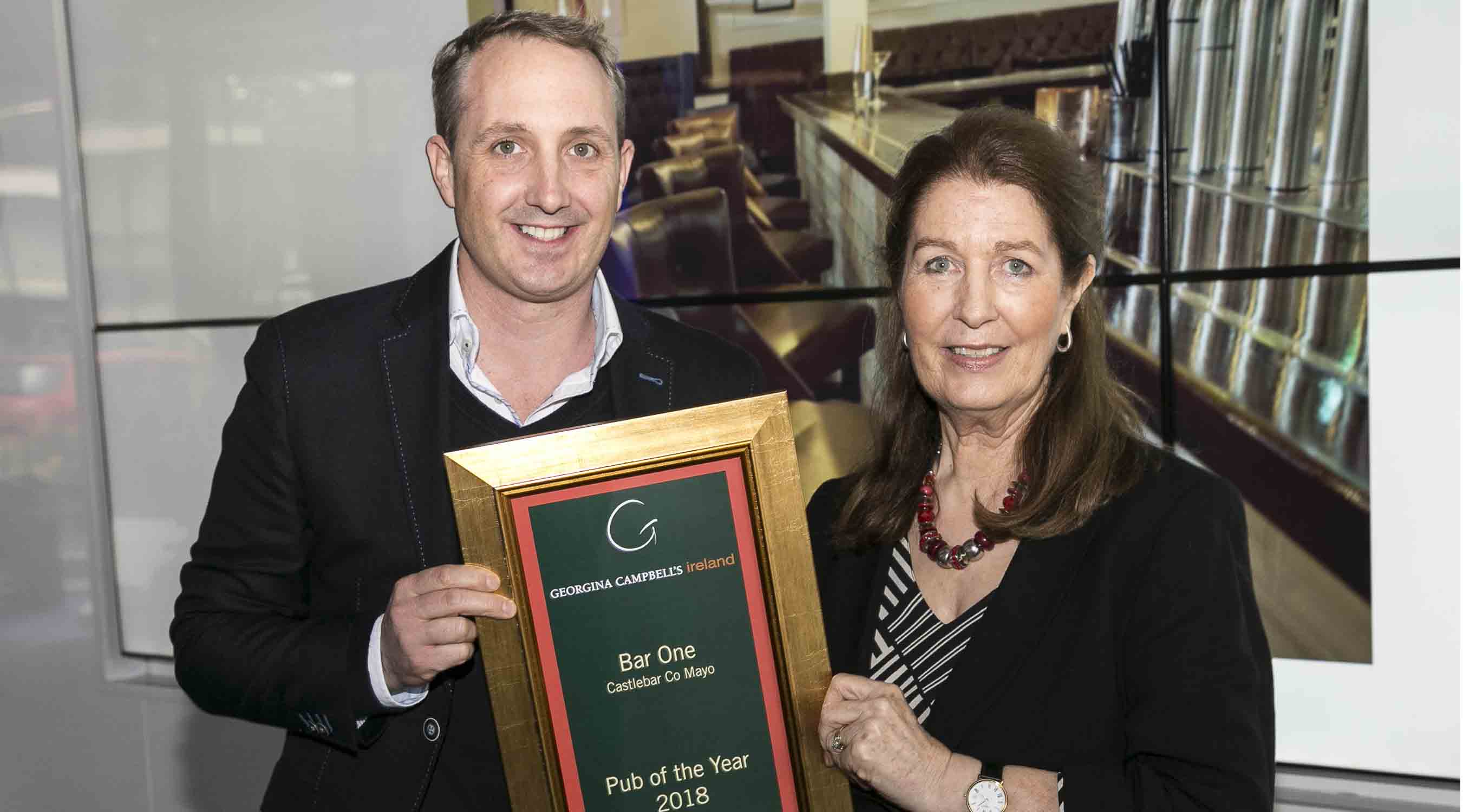 Bar One's Mark Cadden receives his award for Georgina Campbell Guide's Bar of the Year from Georgina Campbell.