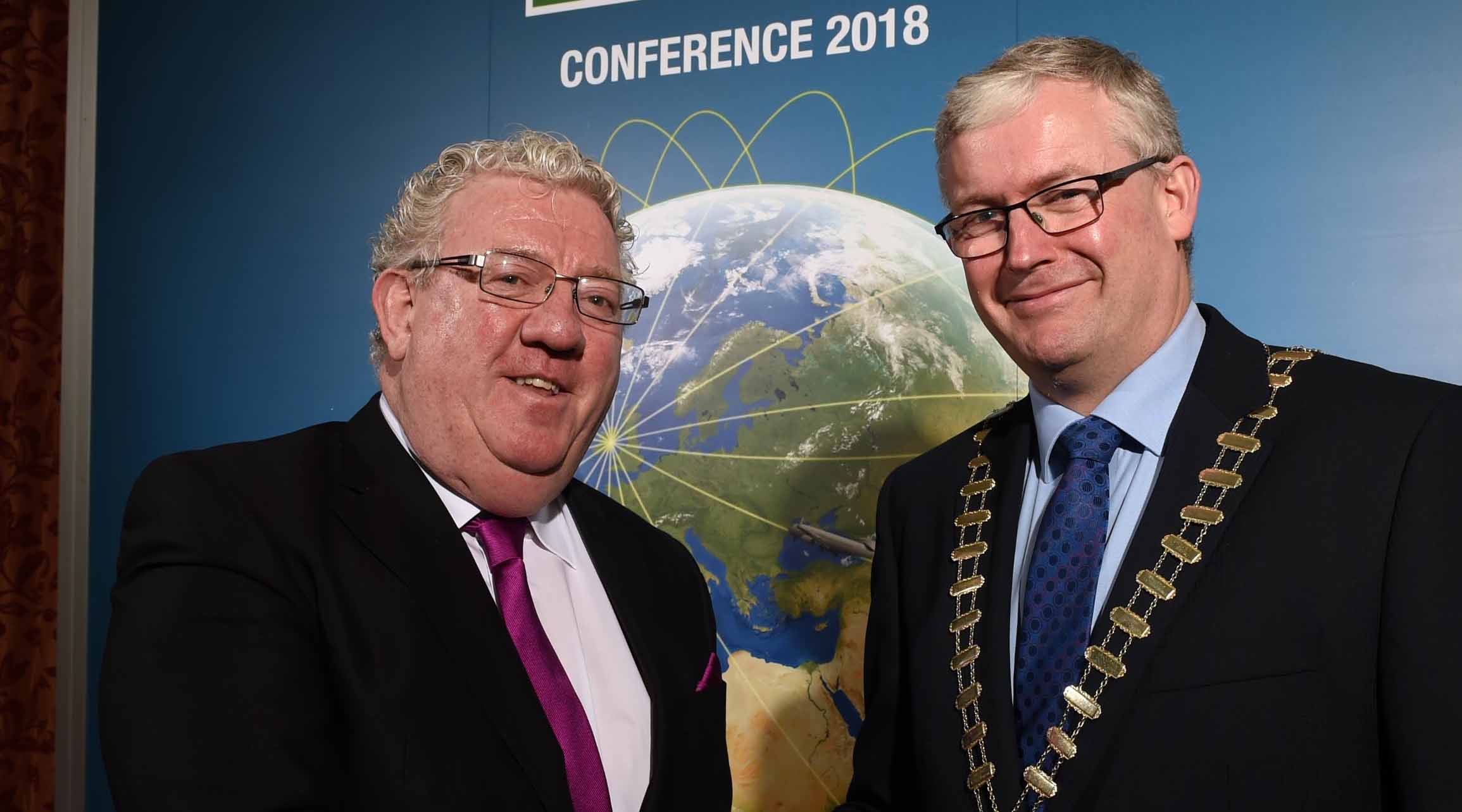 From left: Outgoing IHF President Joe Dolan hands over the Chain of Office to the incoming President Michael Lennon at this year's IHF Conference in Cavan.