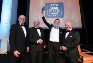 From left: VFI President Padraic McGann and Irish Distillers Pernod Ricard’s Dublin Sales Manager Colm Moran present the Pub Personality of the Year award to Brian Barrett from Geary's Bar, Charleville, Cork, together with LVA Chairman Alan Campbell.