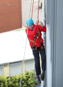 Things are looking up for Tom who participated in the abseil event marking the third anniversary of his injury.