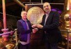 From left: Patsy Doyle from Bowe's Bar in Dulbin receives the Irish Whiskey Bar of the Year from Bushmills' Master Distiller Colum Egan.