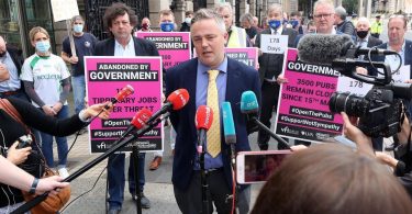 TJ McInerney speaking to the media as he spearheaded the demonstration with fellow publicans, politicians and supporters outside Dail Eireann.