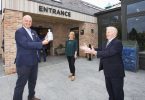 At the Official Opening of The Shed Distillery Visitor Experience were (from left): PJ Rigney and his wife Denise, presenting Noel McPartland, the first visitor to the centre, with an exclusive ceramic commemorative bottle of Gunpowder Gin.