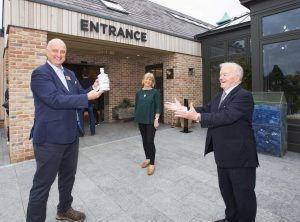 At the Official Opening of The Shed Distillery Visitor Experience were (from left): PJ Rigney and his wife Denise, presenting Noel McPartland, the first visitor to the centre, with an exclusive ceramic commemorative bottle of Gunpowder Gin.