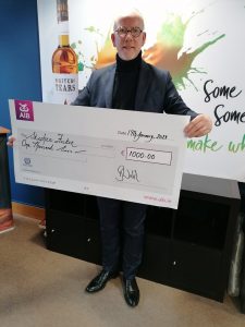 Bernard Walsh of Walsh Whiskey with the third Annual Walsh Whiskey Bursary cheque for €1,000 won by Stephen Foster, a Second Year student in the Brewing & Distilling Degree course at Institute of Technology Carlow.