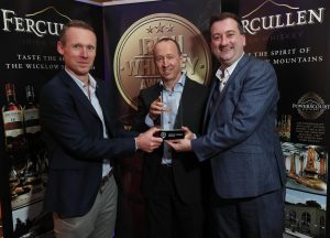 From left: Teeling Whiskey Founder & Manager Jack Teeling presents the Irish Whiskey of the Year Award to Ally Alpine with William Lavelle, Head of the Irish Whiskey Association at last night's Awards in Powerscourt Distillery.