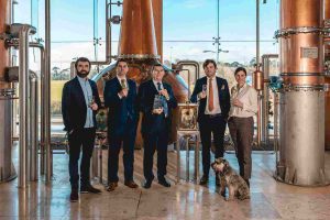 From left: Paddy Cooney with Peter Cooney, Founder Pat Cooney, James Cooney and Sally Anne Cooney celebrate the world's Best New Make award earlier this year, alongside Max the dog.