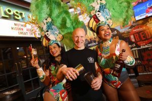 Lost Lane Bartender Toni Mrsic with Mardi Gras Dancers from MaSamba: Laila Bertolino and Samantha Lima.