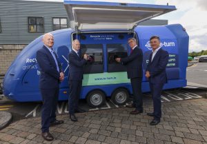 Sean Murphy, LPP, collections partner for Re-turn, Ossian Smyth TD, Tony Keohane, chair ofRe-turn and Séamus Clancy, acting CEO, Re-turn using a reverse vending machine